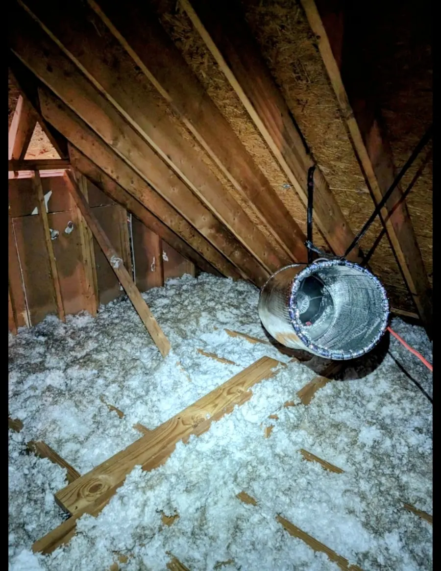 Attic Torpedo hung from the rafters above attic insulation